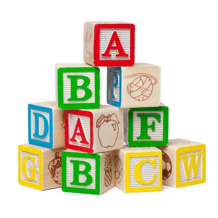 Wooden alphabet blocks isolated on white background